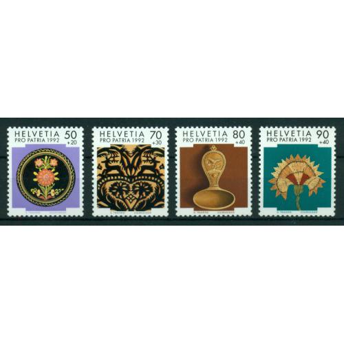 4 timbres neufs** de SUISSE. Art populaire Suisse de 1992