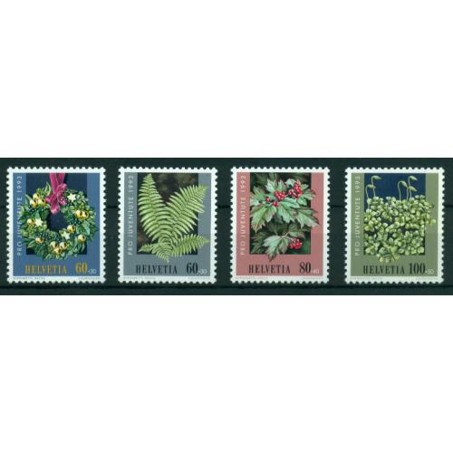 4 timbres neufs** de SUISSE. Noël et plantes de la foret de 1993
